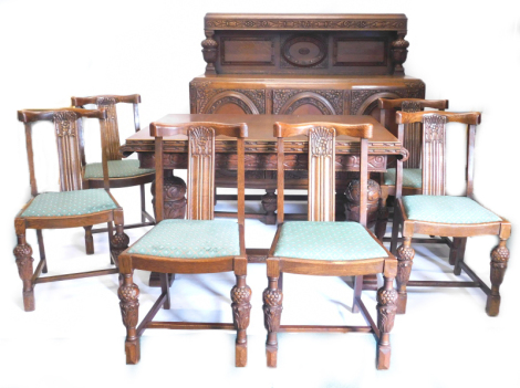 An oak dining room suite, each carved flowers, grapes, leaves, etc., comprising a bow fronted court cupboard with three panelled doors, on cup and cover supports and stretcher, a drawer lead extending dining table on cup and cover supports, and six chairs