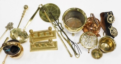 A collection of metalware, to include brass fire dogs, copper kettle, a skimmer, etc.