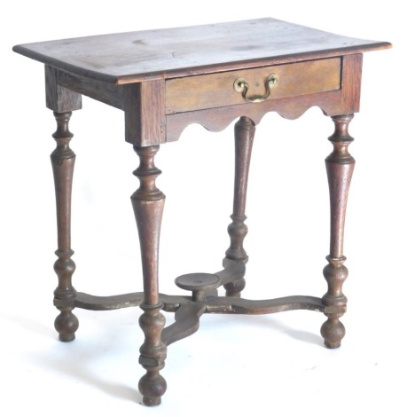 An oak low boy, the rectangular top with a frieze drawer, on turned legs with X shaped flat stretcher and bun feet, in part constructed form old timber, 67cm wide.