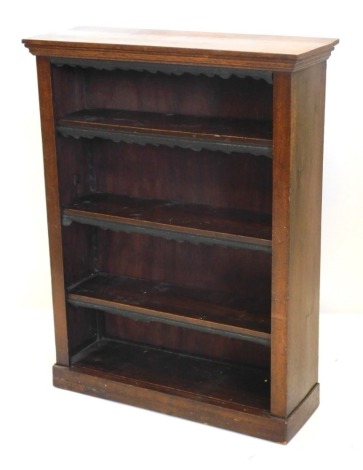 A late 19th/ early 20thC oak open bookcase, with adjustable shelves on a plinth, 84cm wide.