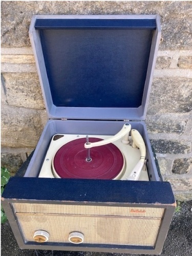 A classic early 1960's Phillips two tone portable record player, with multi-speed RPM, sourced by TV celebrity Danny Sebastian for restoration and servicing. NB. This is a charity lot and there is no Buyers Premium payable. Collection is from The Lincoln