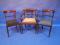 A set of three one plus two Regency mahogany bar back dining chairs