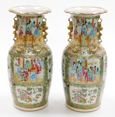 A pair of 19thC Chinese Canton porcelain baluster vases, with gilt kylin handles and applied chilin to the shoulders, decorated with panels of figures at court, birds, flora, and insects, in a famille rose palette, 46cm high. - 10