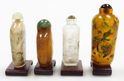 Four Chinese snuff bottles and stoppers, and two clear glass bottles, decorated with landscapes, one amber glass inside painted bottle with warriors and an agate bottle carved in low relief with Putai and mock mask ring handles, with stands, 7cm and 9.5cm - 4