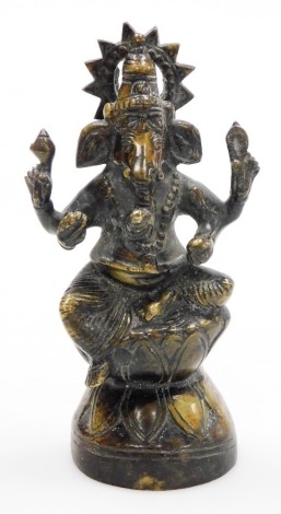 An Oriental cast brass figure of a Ganesh, the elephant god, seated on lotus plinth, 18.5cm high.