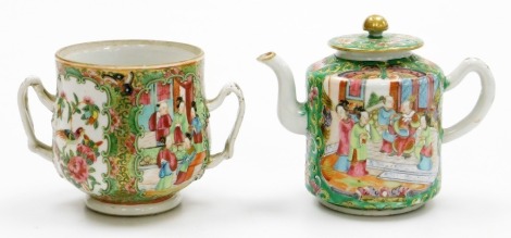 A 19thC Chinese Canton porcelain teapot, decorated in enamels with figures and flowers in shaped panels, and a similar pot bellied sucrier with loop handles, 10cm high. (2)