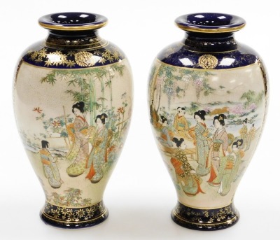 A pair of early 20thC Japanese Satsuma baluster vases, with panels of geishas at leisure in a garden, on a blue ground with gilt floral and diaper decoration, signed to base, 25cm high. - 3