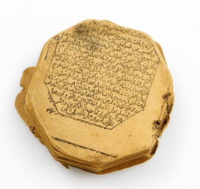 A printed miniature Qur'an, bound with strings, lacking case and possibly incomplete, c.3cm. - 3