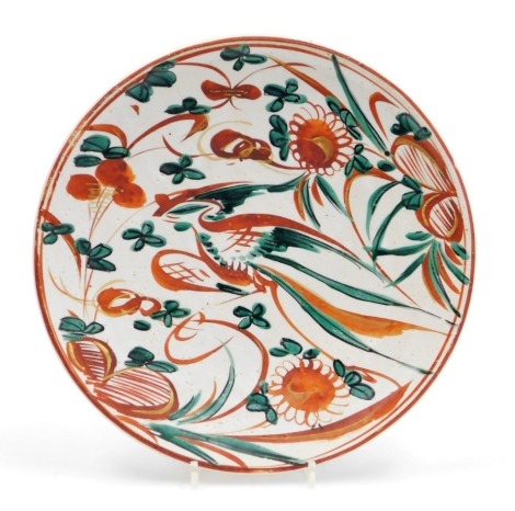 A Japanese Rosanjin style saucer dish, decorated with a bird among flowers, signed Rosanjin to base, 31cm diameter.