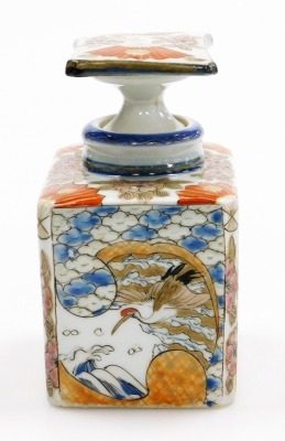 A Japanese Meiji period Arita porcelain bottle and stopper, of rectangular section, decorated with panels of cranes waves and flowers, 13cm high. - 5