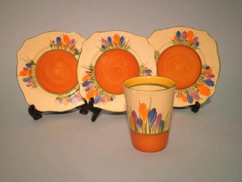 A Clarice Cliff "Bizarre Crocus" pattern beaker and three side