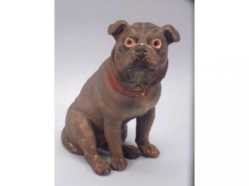 A late 19thC Austrian terracotta figure of a seated pug with glass eyes