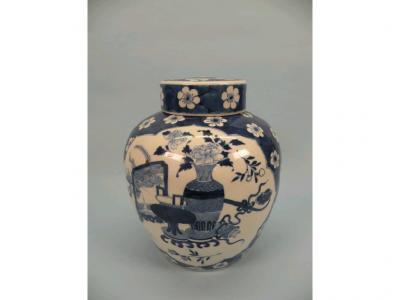 A Chinese blue and white ginger jar and cover decorated in blue with vases