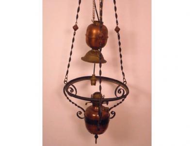 A late 19thC wrought iron and copper ceiling oil lamp with weighted