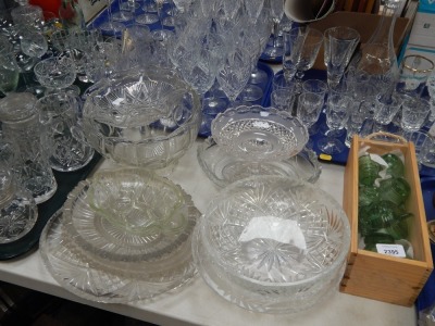 A large group of assorted glass ware, drinking glasses, tumblers, jugs, serving bowls, etc. (5 trays plus)