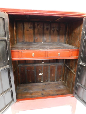 A Chinese 19thC red lacquer marriage cupboard, the outswept pediment over a pair of doors opening to reveal a shelf, above two frieze drawers, with recess below, raised on stile feet, 172cm high, 111cm wide, 61cm deep. - 3