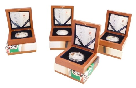 A set of four 2008 Beijing Olympic Games silver proof coin collection series 2, boxed.