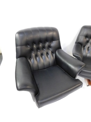 A pair of G-Plan mid century black leather swivel chairs, each on a wooden base with castors, with button back and detailing, 85cm high, 92cm wide, 85cm deep. - 3