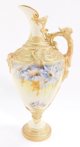 A Royal Worcester blush porcelain jug, circa 1895, of baluster form with heavily moulded scroll and mask detailing, painted in blue and yellow with flowers, shape no 1742, printed marks, 24cm high.