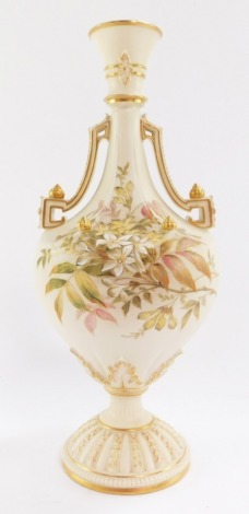 A Royal Worcester blush ivory porcelain vase, circa 1892, of twin handled, baluster form, painted with meadow flowers and blossom, numbered 1535, printed marks 30cm high.