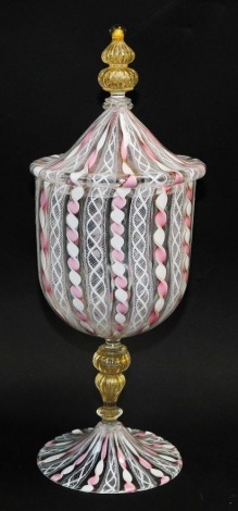 A Venetian latticino glass sweetmeat vase and cover, of baluster form, with a fluted knop and stem, decorated with vertical bands in pink and white spiral twist, 34cm high.