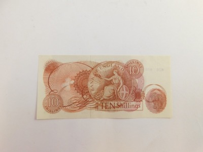 A Bank of England 10 shillings note, red/brown, Forde, number M76 805709, circa 1963. - 2