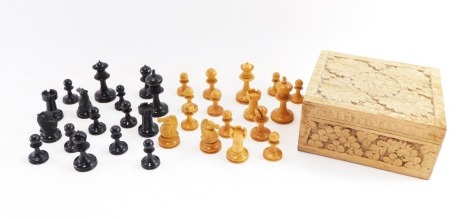 A Staunton chess set, with two sets of turned boxwood and ebony chess pieces, in an Eastern style box.