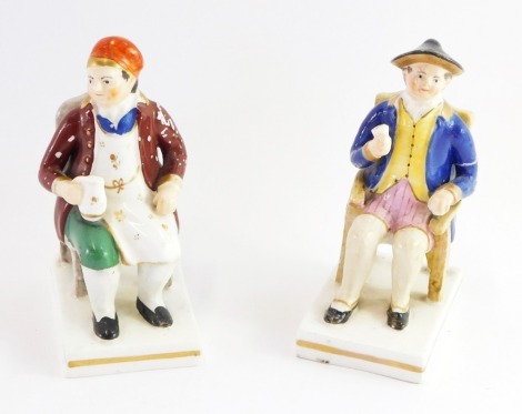 A pair of Staffordshire 19thC porcelain figures, each depicting a gentleman seated, drinking, with a gilt border, one titled Southern Johnny., and the other Timmy Shancker, each 13cm high.