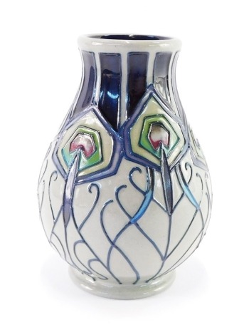 A Moorcroft pottery vase decorated in the Peacock Parade pattern, circa 2012, impressed and painted marks, 10cm high.