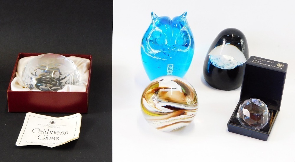 A group of paperweights, comprising a Caithness engraving domed