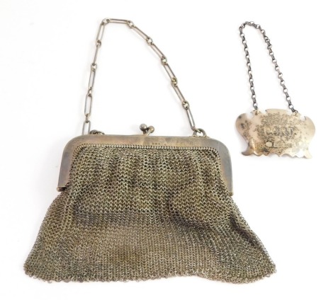 Two items of silver, comprising a silver port label, Sheffield 1977, together with a silver mesh chain mail evening purse with a velvet lined interior, with silver import marks, 4¼oz gross. (2)