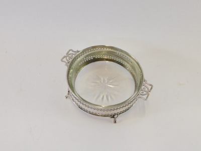 A George V silver and cut glass sweet dish, of twin handled circular form, raised on four fleur-de-lis feet, Birmingham 1925, 1½oz of weighable silver. - 2