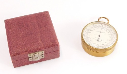 A T Wheeler of London early 20thC brass cased compensated barometer, in a fitted case, the dial 5cm wide.