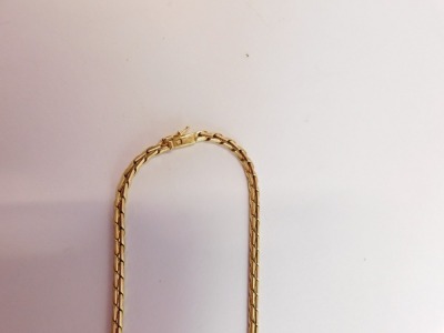 A double S link neck chain, on a snap clasp marked 9kt, 41cm long. - 2