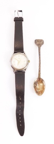 An Ebel gents wristwatch, with Swiss movement in stainless steel case, numbered 9123906 48 6, together with a silver topped and Viking design spoon. (2)