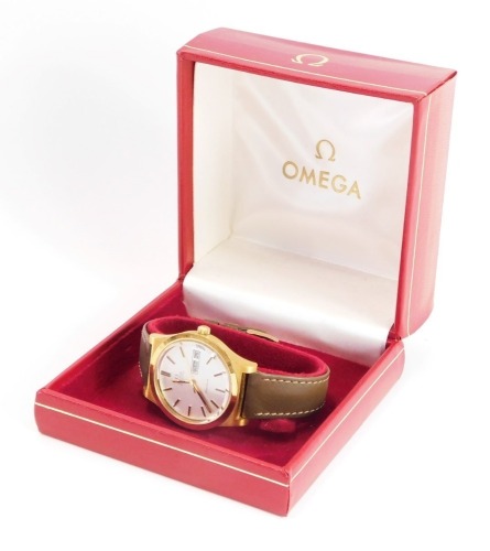 An Omega automatic gentleman's gold plated wristwatch, with brushed gold coloured finish outer casing on silver dial with date aperture and later brown leather strap, the dial 3.5cm wide, in Omega box.