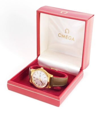 An Omega automatic gentleman's gold plated wristwatch, with brushed gold coloured finish outer casing on silver dial with date aperture and later brown leather strap, the dial 3.5cm wide, in Omega box.