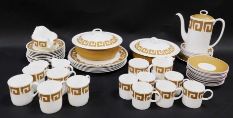 A Wedgwood Susie Cooper design porcelain part coffee and dinner service, decorated in the Old Gold Keystone pattern, comprising five teacups, six coffee cans, coffee pot, sugar bowl, two serving tureens, two milk jugs, two sugar bowls, gravy boat, various