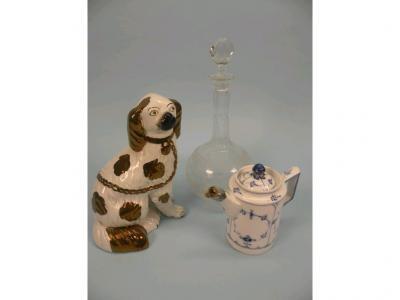 A Staffordshire Pottery spaniel with cooper lustre decoration