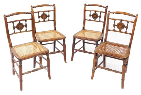 A set of four Regency beech and cane seated chairs, the bobbin turned backs with central circle panel on cane seating, 81cm high, 35cm wide, 35cm deep.