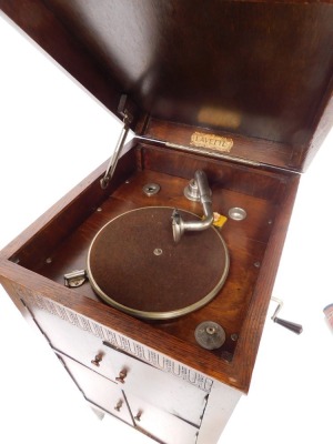 A Lavette oak cased cabinet gramophone, the levered top gramophone section over a two door enclosed sound box, over two further doors, raised on tapering square legs, 93cm high, 42cm wide, 47cm deep. - 3