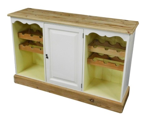 A painted pine sideboard, with scrub pine top and two outer wine rack sections, with central cupboard door, finished in white, on a pine base, 90cm high, 137cm wide, 39cm deep.