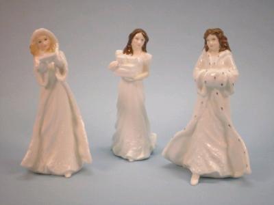 Three Royal Doulton porcelain figures "Christmas Day"