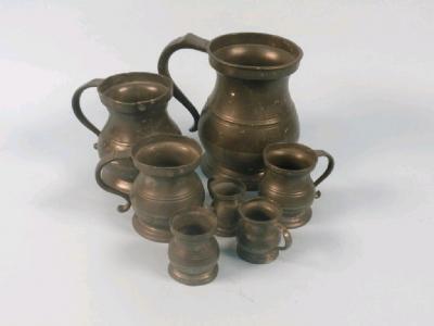 A composite set of seven pewter measures