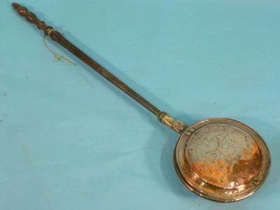 A 19thC brass warming pan with a turned fruitwood handle