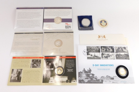 A group of D-Day and aviation proof coins, a D-Day 75 £5 silver proof coin with enamel detailing, a Avro Vulcan V Class Bomber silver proof coin, the D-Day £5 coin presentation pack, The End of The War British Legion 60th Anniversary presentation pack, Th