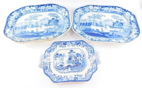 A group of blue and white wares, comprising a Masons blue and white chinoiserie soup tureen stand, 38cm wide, and two large 19thC blue and white meat plates, one with tree and well, decorated in the Newnham Courtenay pattern, 49cm x 36cm. (3)