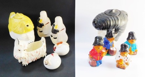 A small group of novelty ornaments, comprising two Beswick teapots, a pair of Carltonware cello salt and pepper pots, a Czechoslovakian dog trinket box, two paperweights of male and female in swimwear marked Foreign and four Paddington Bear ornaments. (a 