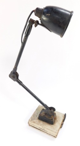 A vintage black anglepoise type desk lamp, with switch, on a made up wooden base, printed Made in England, 60cm high. (AF)
