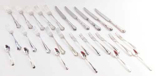 An Italian part table service, comprising a set of table knives and forks, each shell pattern, marked 800., together with a set of pickle forks and spoons, with similar markings, with dust protectors, 33.99oz all in.